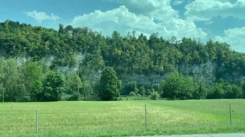 Scenic Countryside With Green Fields and Rock Cliffs Video stock 342264482