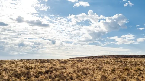 A scenic daytime drive time lapse on a gravel road with two dirt tracks in a Stock-Footage 143641781