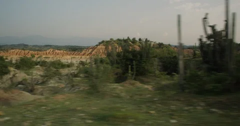 Scenic desert landscape at sunset passing by shot from car Stock Footage 86101645
