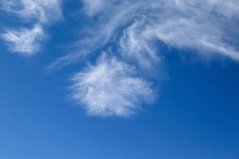 Scenic dramatic summer clouds. Cloudscape of bright blue sky. Cloud backgroun Stock Photos