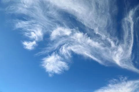 Scenic dramatic summer clouds. Cloudscape of bright blue sky. Cloud backgroun Stock Photos