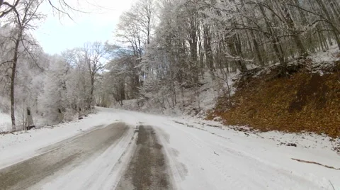 Scenic drive along forest highlands in winter, Go Pro Stock Footage 59797340