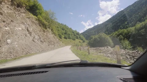 Scenic drive through mountain roads on sunny day Stock Footage 301402575