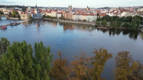 Scenic drone flight over the Vltava river in Prague in autumn. Aerial view Stock Footage 256161668