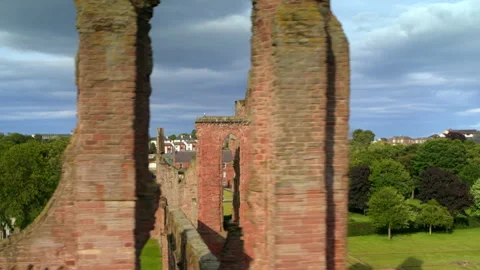 Scenic drone flying through Arbroath Abbey ruins Stock Footage 336778629