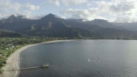 Scenic drone panorama from Mountains and Beach on an Island with boat bridge Stock Footage