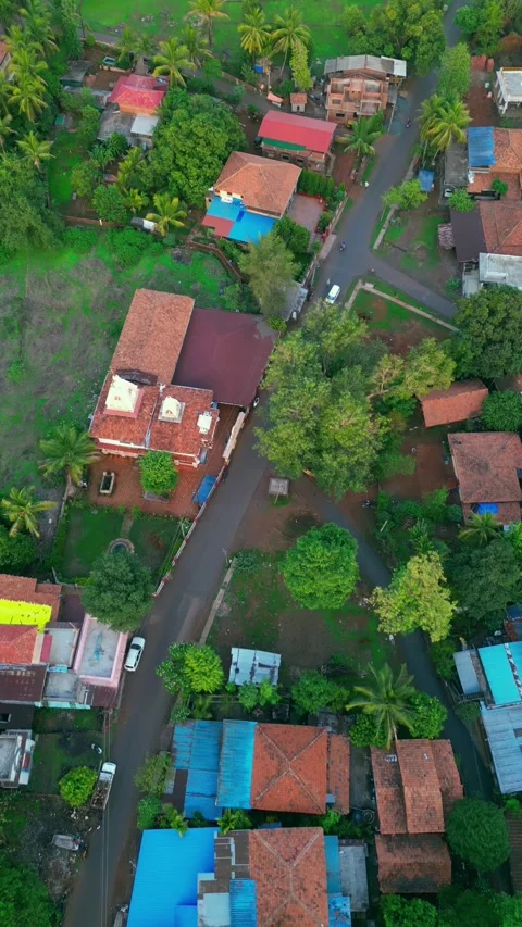 Scenic drone shot of Devrukh, Konkan, showcasing lush greenery, village homes Stock Footage 306149139