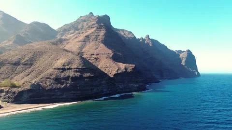 Scenic drone view of virgin beach with torquoise water seascape with mountains Видео 288116454
