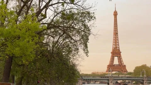 Scenic Eiffel Tower view at sunset from Seine riverbank Stock Footage 336425679