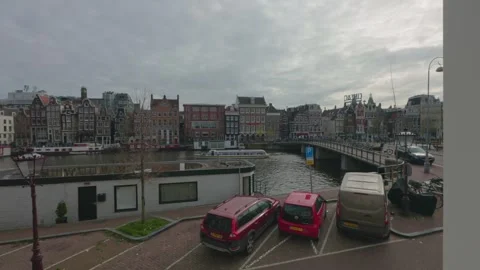 A scenic elevated view overlooks a canal in the heart of Amsterdam Stock Footage 332618877