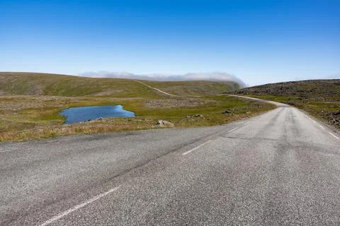 Scenic empty remote road nowhere near North cape Stock Photos