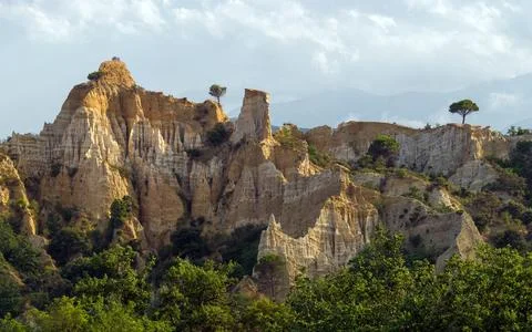 Scenic Eroded Cliffs and Pine Trees in Mountain Landscape Stock Photos