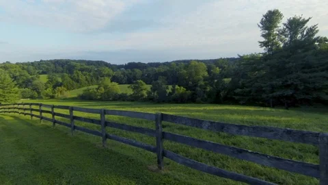 Scenic Farm Fly Over Fence and Fields - Drone Stock Footage