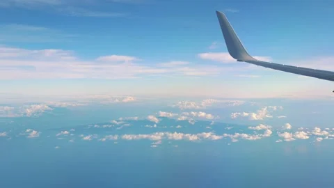 Scenic flight over clouds with ocean view in 4k Stock Footage 279537390