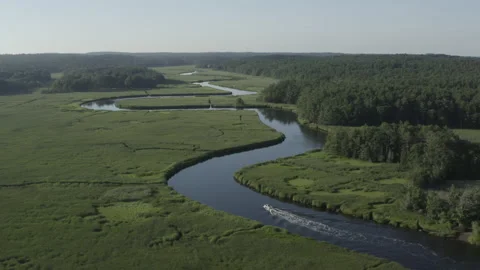 Scenic Flight over North River with Motorboat in New England Stock Footage 152852914