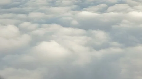 Scenic flight through heavy clouds. View through an airplane window. Stock Footage 39377548