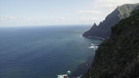 Scenic footage of dramatic and dangerous rocky cliffs jagged to ocean. Stock Footage 70454237
