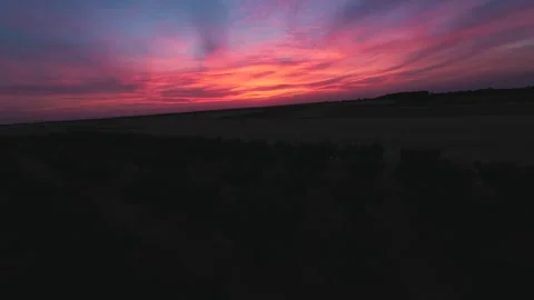 Scenic FPV drone flight over bulgarian fields at dusk. Aerial footage, Bulgaria Stock Footage 316522152