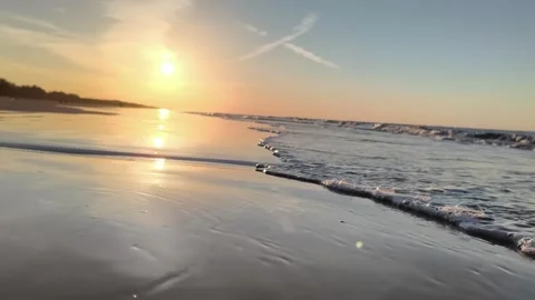 Scenic Golden Hour Ocean Waves on Sandy Beach Sunset Video stock 340215937