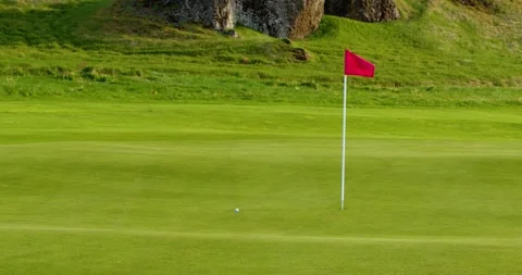 Scenic Golf Course with Red Flag Stock Footage 337723312