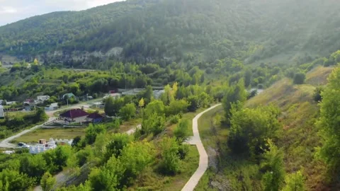 Scenic Green Hillside with Winding Path Stock Footage 327894967