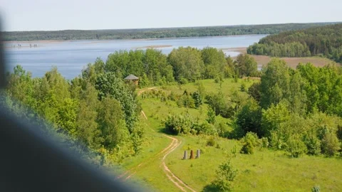 Scenic high angle view of a lake and green forest Vídeo Stock 322651217