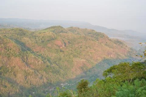 Scenic high angle view of a misty rural valley. Stock-Fotos