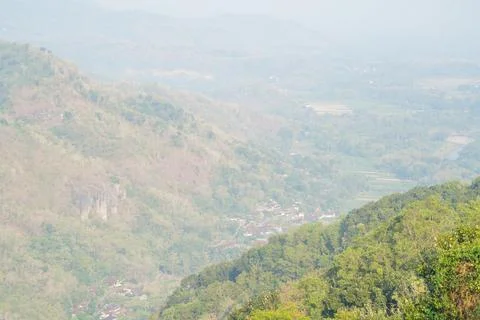 Scenic high angle view of a misty rural valley. Stock Photos