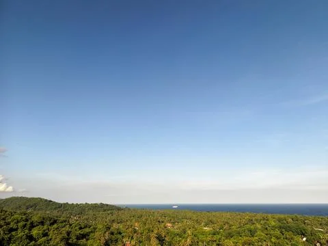Scenic High Angle View of Vast Blue Sky Over Tropical Coastal Forest Stock Photos