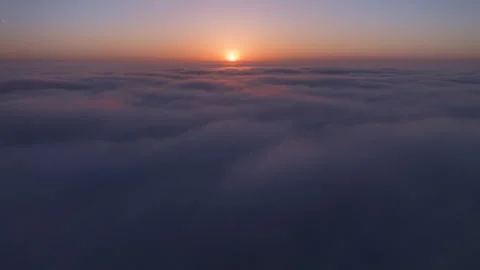 Scenic hyperlapse above rainclouds swirling below the drone camera Cinematic sun 스톡 동영상 250586955