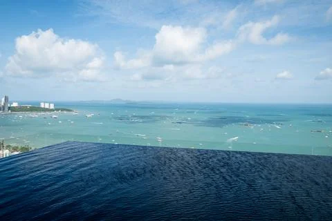 Scenic infinity pool overlooking blue ocean pattaya thailand travel serene .. Stock Photos