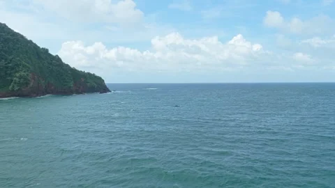 Scenic java island coastal landscape with a fishing boat 스톡 동영상 328920859