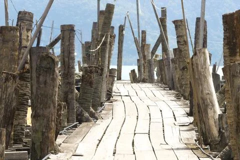 A scenic jetty built with coconut tree as pole in Langkawi Island Malaysia Stock Photos