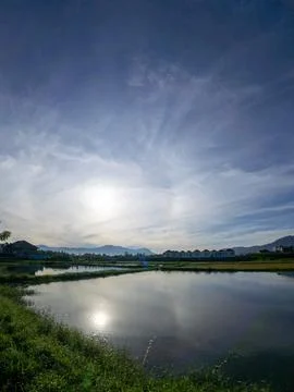 Scenic Lake Reflection Under Cloudy Sky 스톡 사진