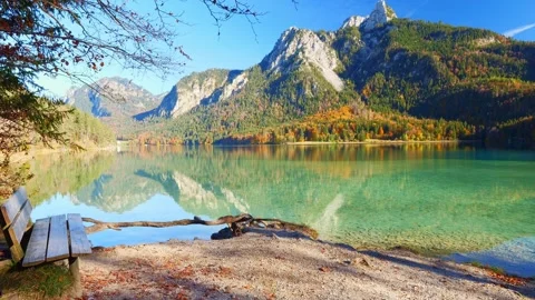 Scenic lake reflections of vibrant fall colors near Hohenschwangau with tranq Stock Footage 308323411