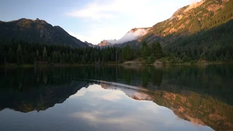 Scenic lake with ripples mountain reflection Stock Footage