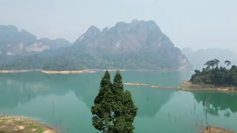 Scenic Lake View with Mountain Reflections in Khao Sok, Thailand Stock Footage 335580497