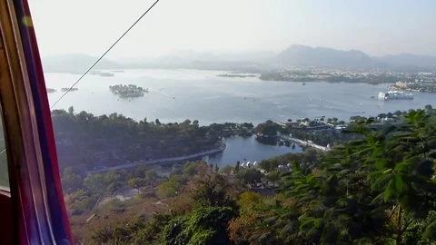 Scenic lake view from moving Ropeway cable car ride,Udaipur city Rajasthan India Stock Footage 107578563