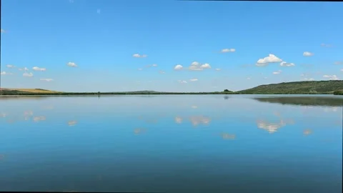Scenic Lake Water Reflection at Delta Moldovei Iasi Romania under Blue Sky Video stock 341670034
