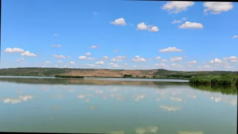 Scenic Lake Water Reflection at Delta Moldovei Iasi Romania under Blue Sky Video stock 341670191