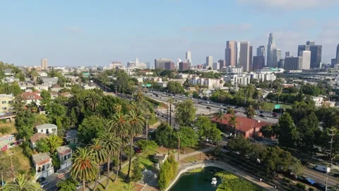 Scenic landscape of Echo Park Lake and downtown Los Angeles skyline with freeway Stock Footage 336634429