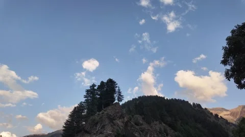 Scenic Landscape of an Evening View Featuring Trees and Majestic Mountain Ra Stock Footage 289193005