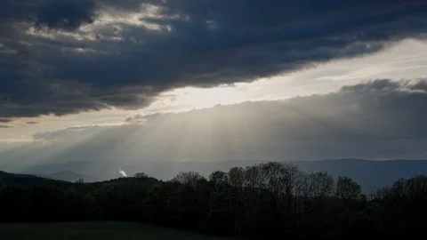 Scenic landscape with mountain range and forest. Sunset. The sun's rays are 库存影片 115363457