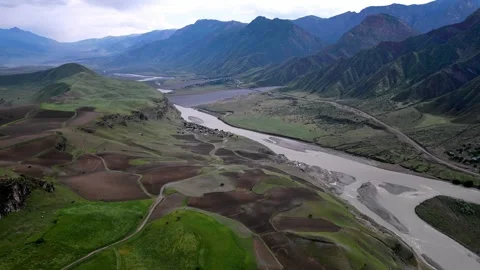 Scenic Landscape Overview. Drone view Winding River Crossing Diverse Terrain Stock Footage 339622851