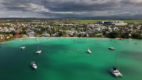 Scenic landscape of storm clouds gather over coastal town Stock Footage 307608752
