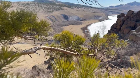 Scenic landscape view from mountain peak. spring river covered with ice Stock Footage 292729791