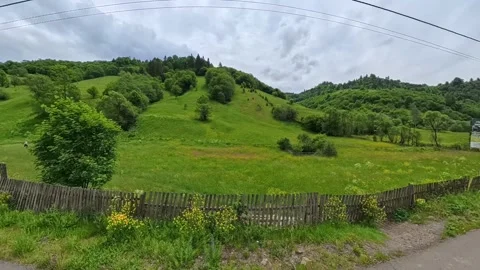 Scenic landscape view from a moving car or train window showing a calm river Vídeo Stock 346181350