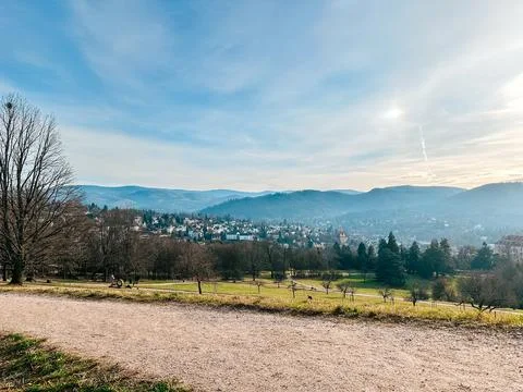 Scenic landscape view showcasing rolling hills, lush greenery, and a charming Stock Photos