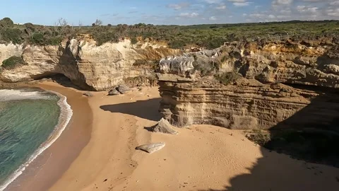 Scenic Limestone Cliffs and Beach at Great Ocean Road Stock Footage 338172100