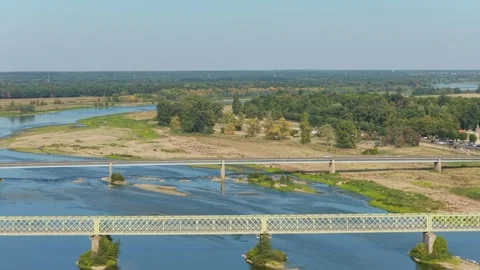The scenic Loire River flowing through the lush countryside at Sully-sur-Loire Stock Footage 346713156